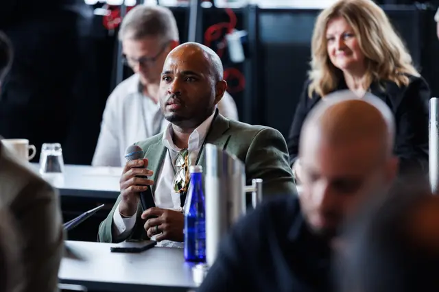 A guest at the microphone during the question and answer