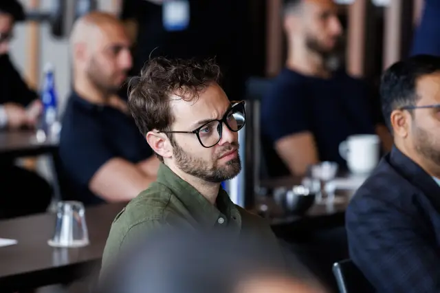 A guest following the discussion intently