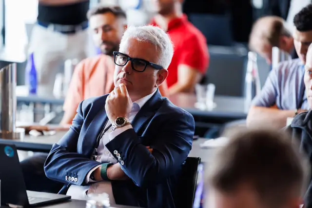 A delegate considering a point during a session