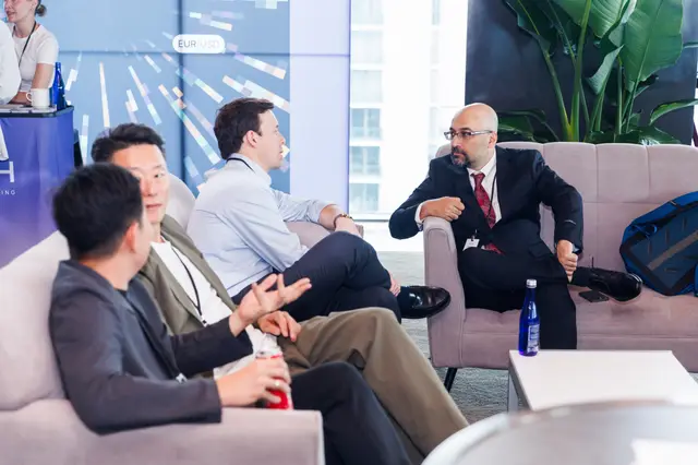 An animated lounge conversation between guests