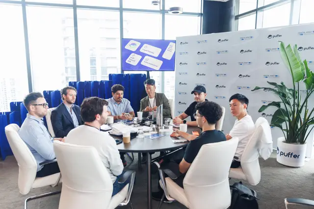 A bright roundtable discussion by the windows