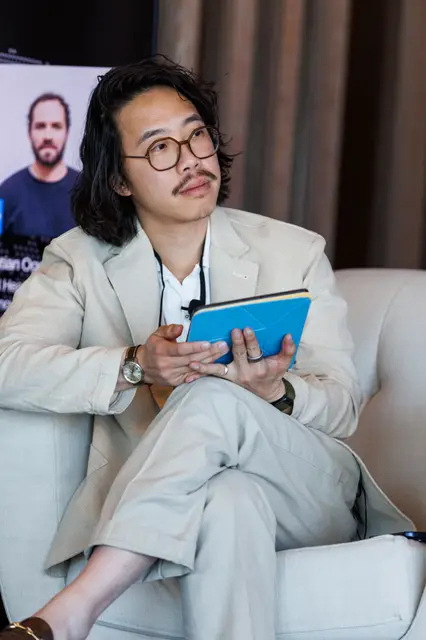 A speaker in quiet thought between sessions